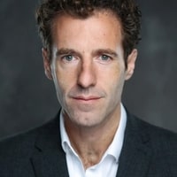 James Rose, Award-Winning Therapist & C-Suite Executive Coach, James Rose Coaching seen in a black color suit